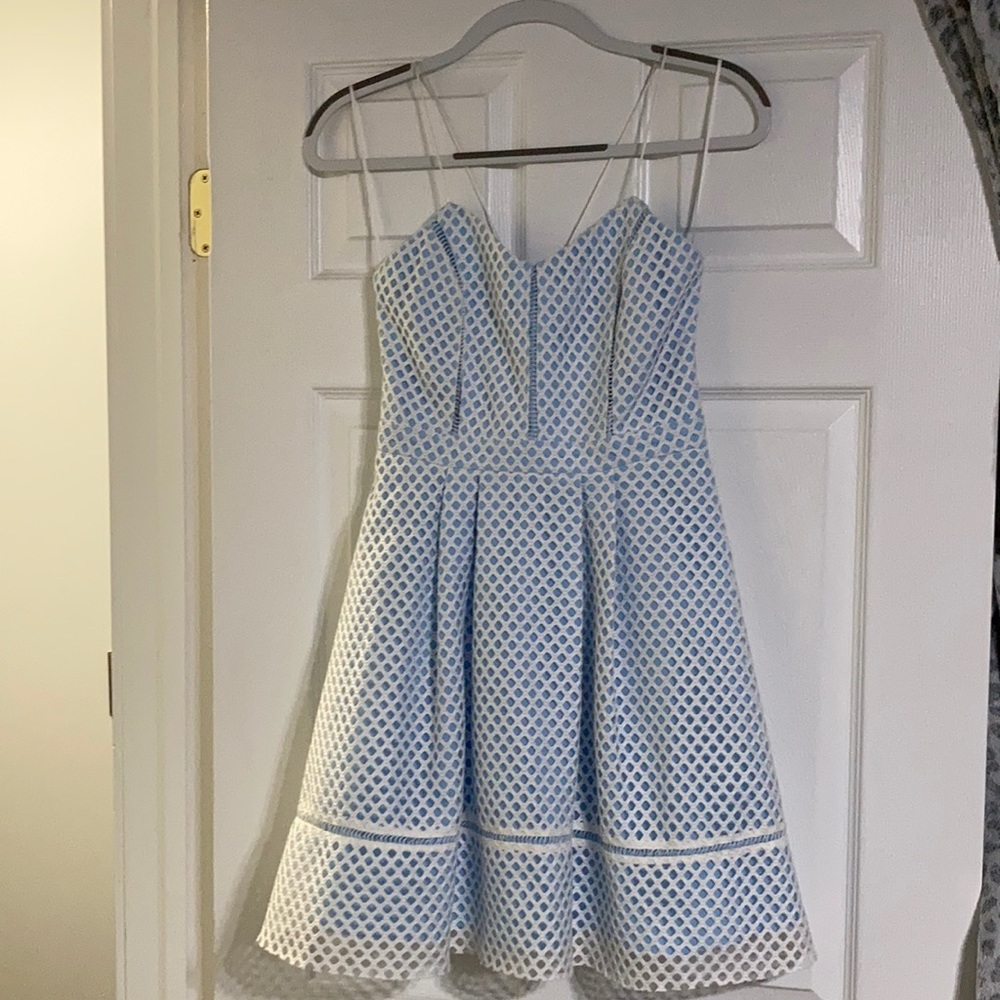Topshop light blue/white mini dress/fish net detailing. Spaghetti straps/size 6